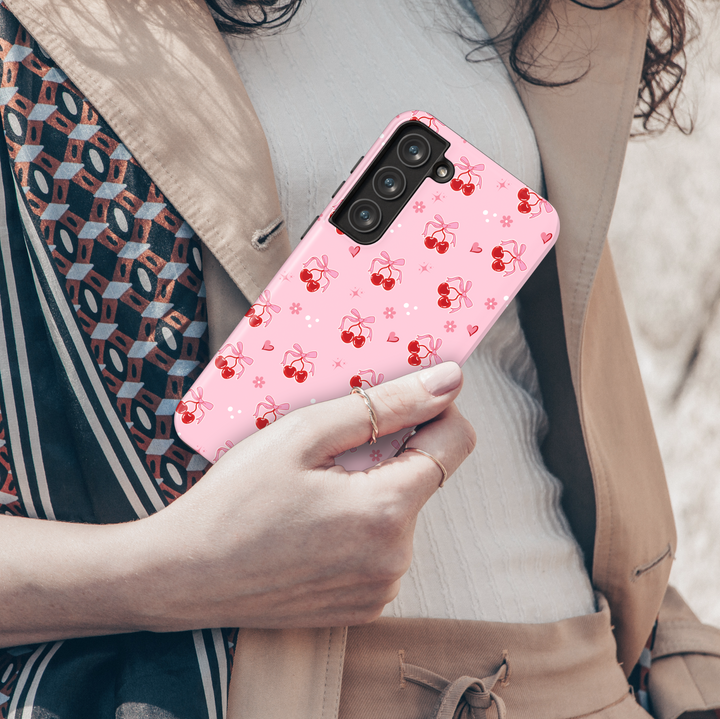 Coquette pink Samsung Galaxy case with red cherries, heart bows, and floral accents – cute girly aesthetic protective phone cover