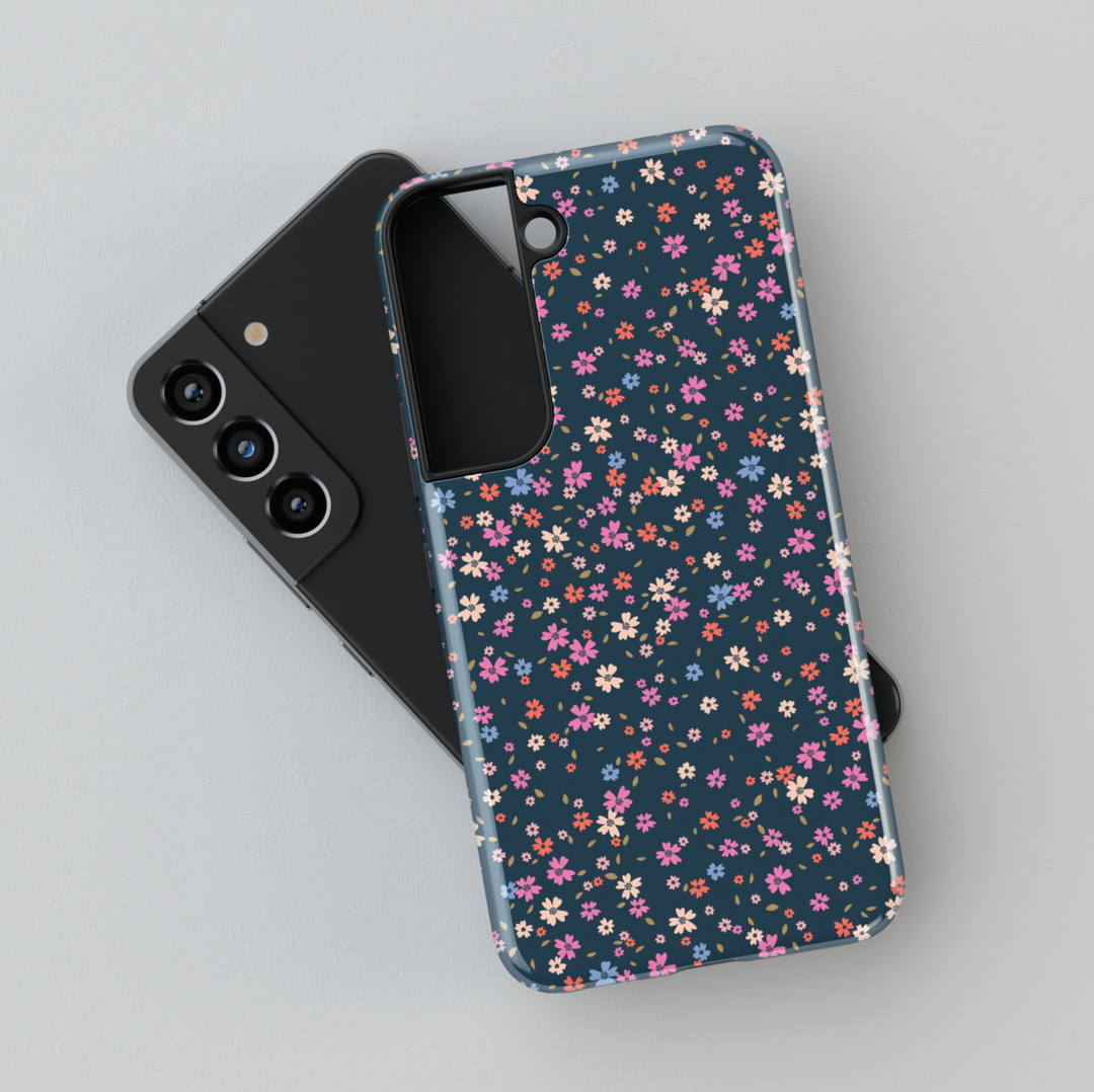 Galaxy phone case with tiny multicolored floral print on dark navy background – aesthetic garden-style design
