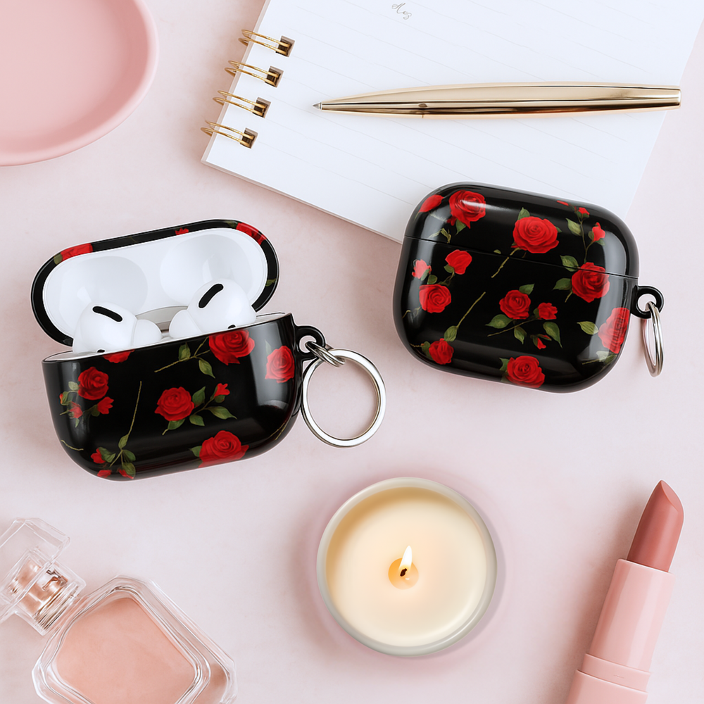 Glossy black AirPods case with red rose floral pattern and silver keyring, romantic aesthetic protective cover for AirPods Pro or AirPods 3.