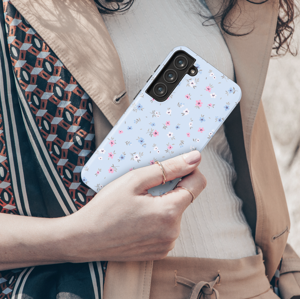 Pastel blue floral Galaxy case with small pink, blue, and white flowers – cute spring phone cover for women