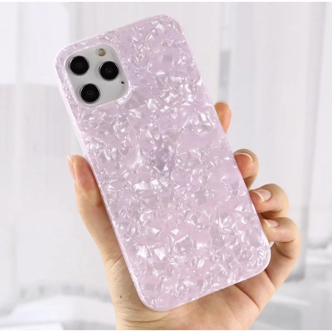 Glossy pearl pink iPhone case with a luxurious shimmer shell texture, designed for a stylish and protective fit.