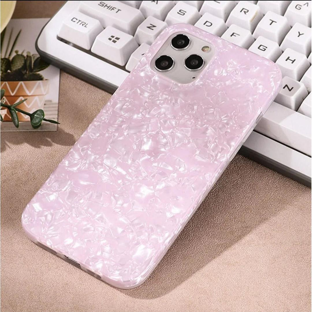 Glossy pearl pink iPhone case with a luxurious shimmer shell texture, designed for a stylish and protective fit.