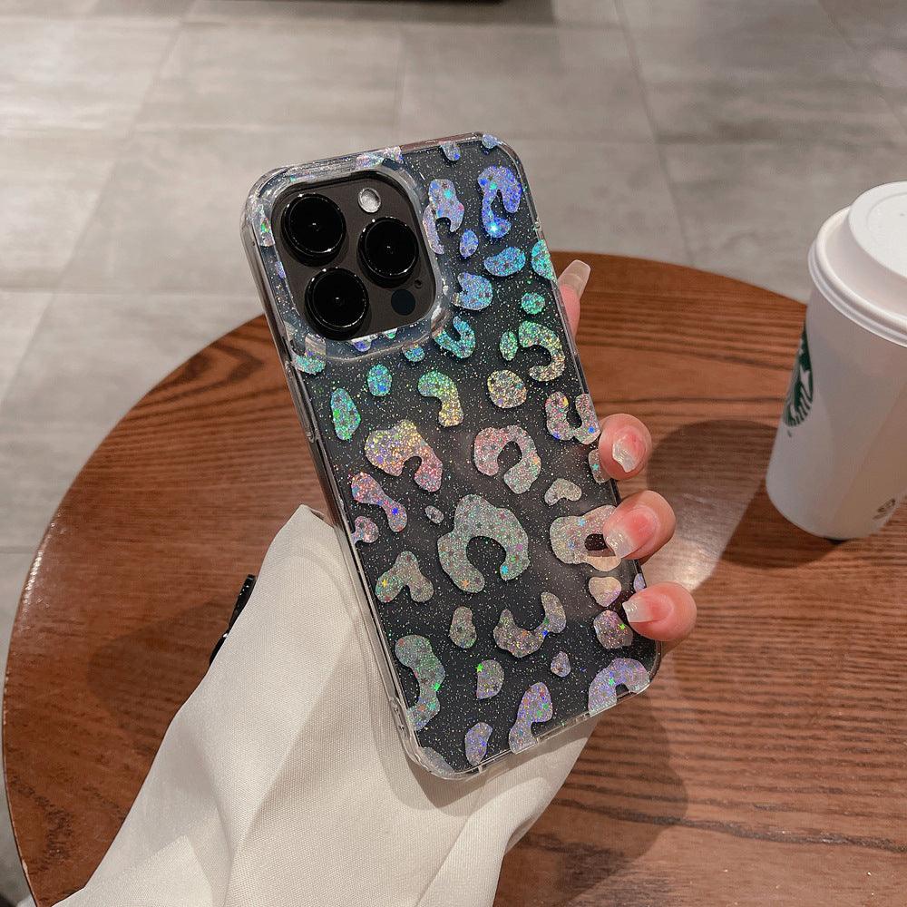 Stylish clear iPhone case featuring a holographic leopard print design with glitter details. The shimmering pattern reflects light beautifully, giving off a stunning iridescent effect. Perfect for those who love bold and trendy accessories while keeping their phone protected in style.