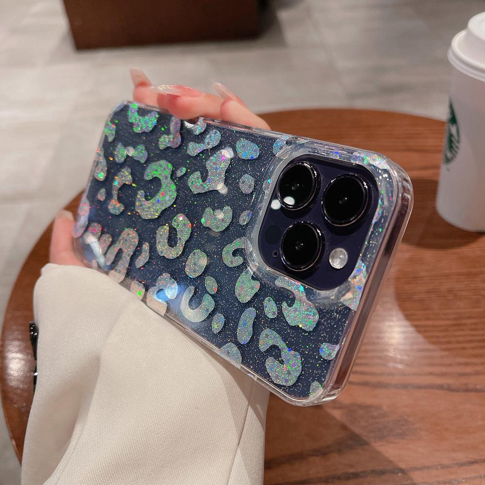 Stylish clear iPhone case featuring a holographic leopard print design with glitter details. The shimmering pattern reflects light beautifully, giving off a stunning iridescent effect. Perfect for those who love bold and trendy accessories while keeping their phone protected in style.