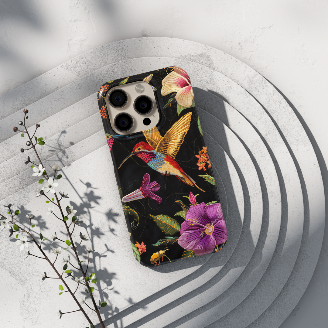 Noctyra Bloom dark floral stained glass hummingbird iPhone case on black background