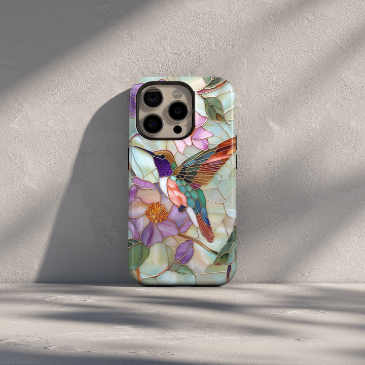 Stained glass hummingbird iPhone case with pastel flowers and mosaic background