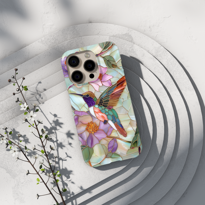 Stained glass hummingbird iPhone case with pastel flowers and mosaic background