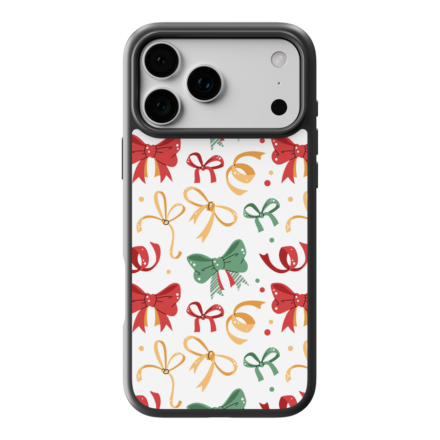 White Christmas phone case with red, green, and gold holiday bows and ribbons