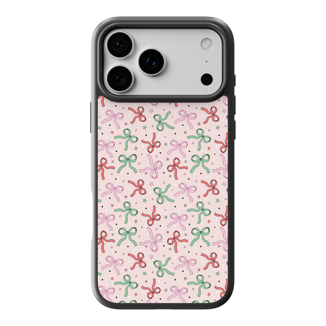 Pink Christmas bow pattern phone case with red, green, and pastel bows