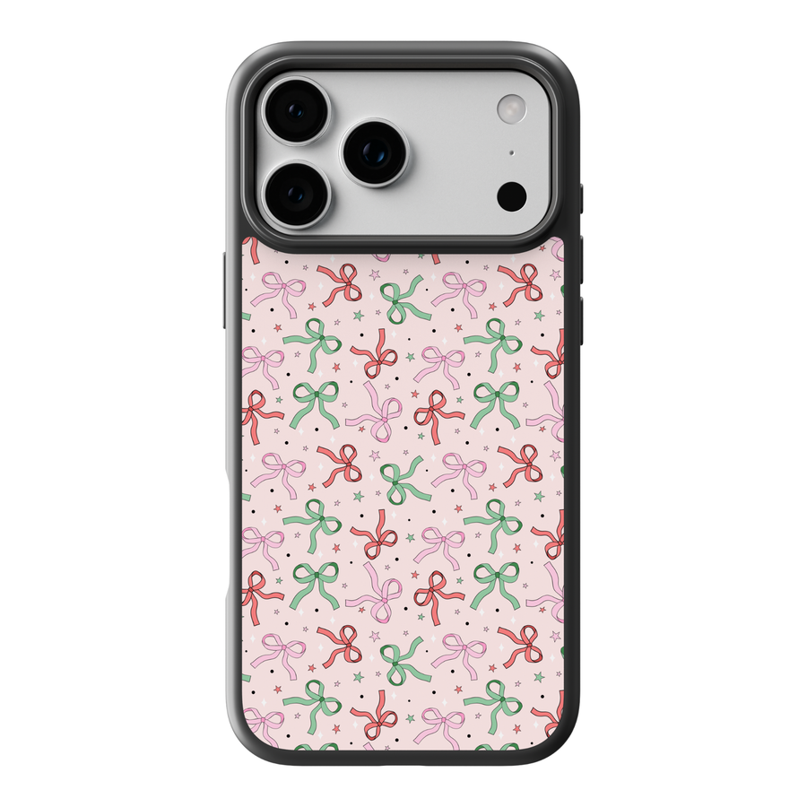 Pink Christmas bow pattern phone case with red, green, and pastel bows