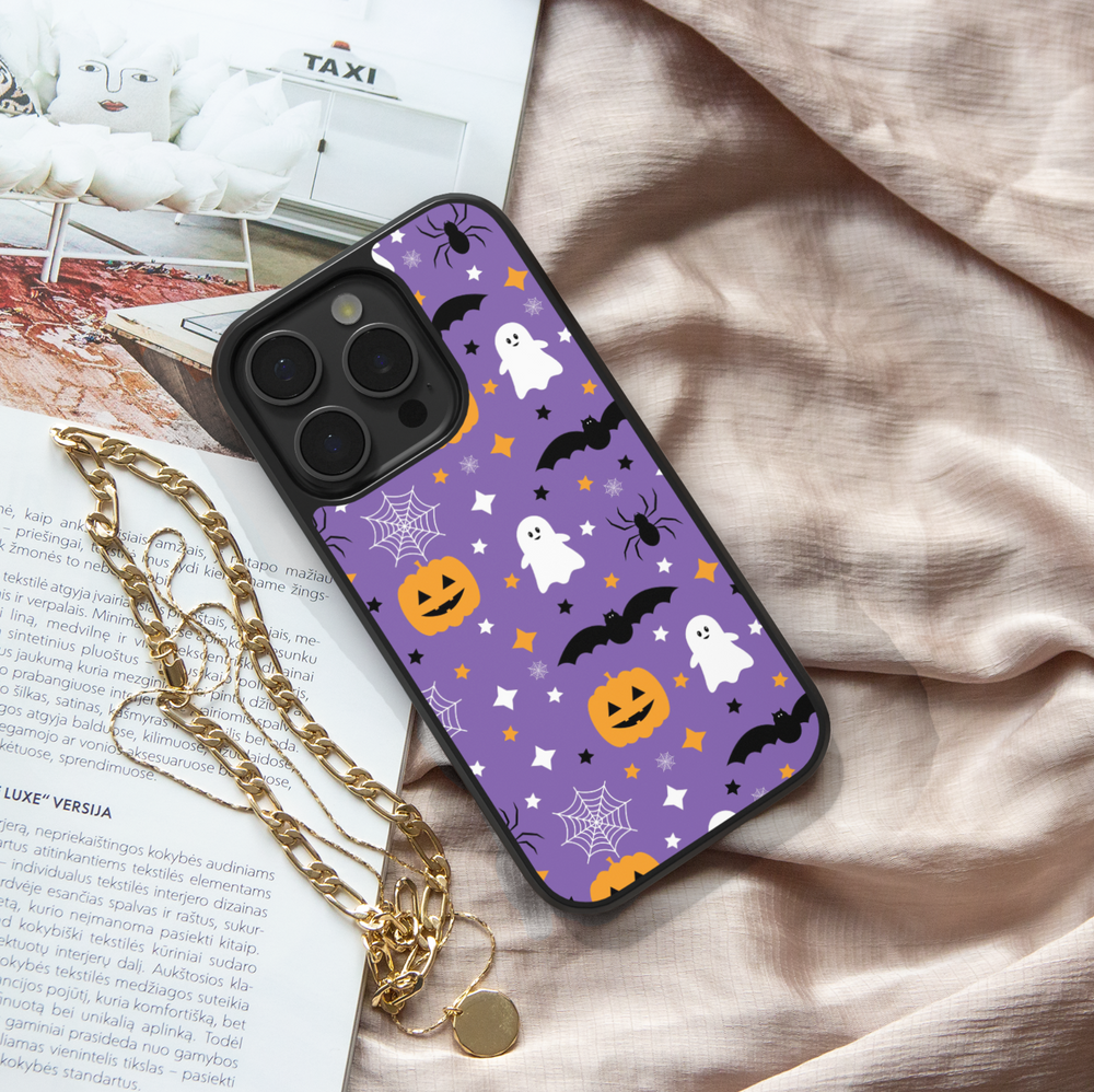 Purple Halloween phone case with ghosts, pumpkins, bats, spiders, and stars.