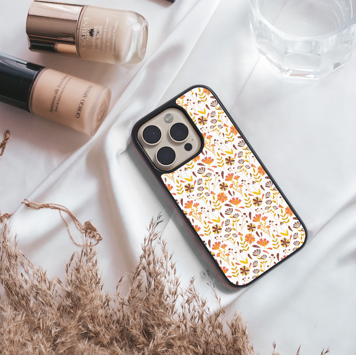 Fall floral iPhone case with autumn flowers pattern in orange, yellow, and brown colors – cute and aesthetic protective cover for iPhone models.