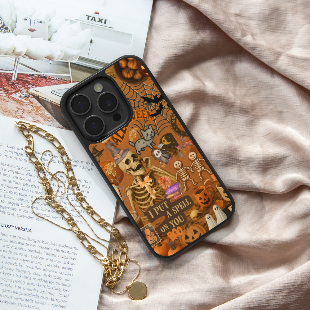Halloween iPhone case with vintage collage design, spooky skeleton, pumpkins, ghosts, cobwebs, witch hat, retro orange background, aesthetic spooky cute Halloween phone cover
