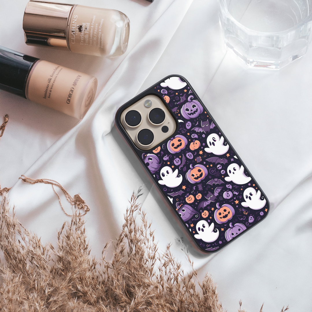 Halloween haunted house phone case with glowing pumpkins, ghosts, bats, and colorful night sky – spooky protective iPhone and Samsung Galaxy cover for Halloween aesthetic