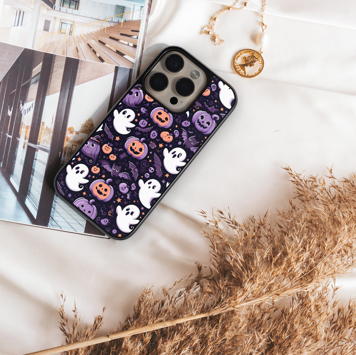 Halloween haunted house phone case with glowing pumpkins, ghosts, bats, and colorful night sky – spooky protective iPhone and Samsung Galaxy cover for Halloween aesthetic