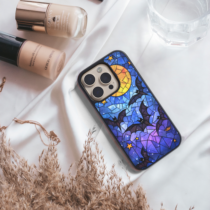 Stained glass Halloween iPhone case with moon, flying bats, stars, gothic aesthetic, spooky night phone cover, protective case for iPhone.