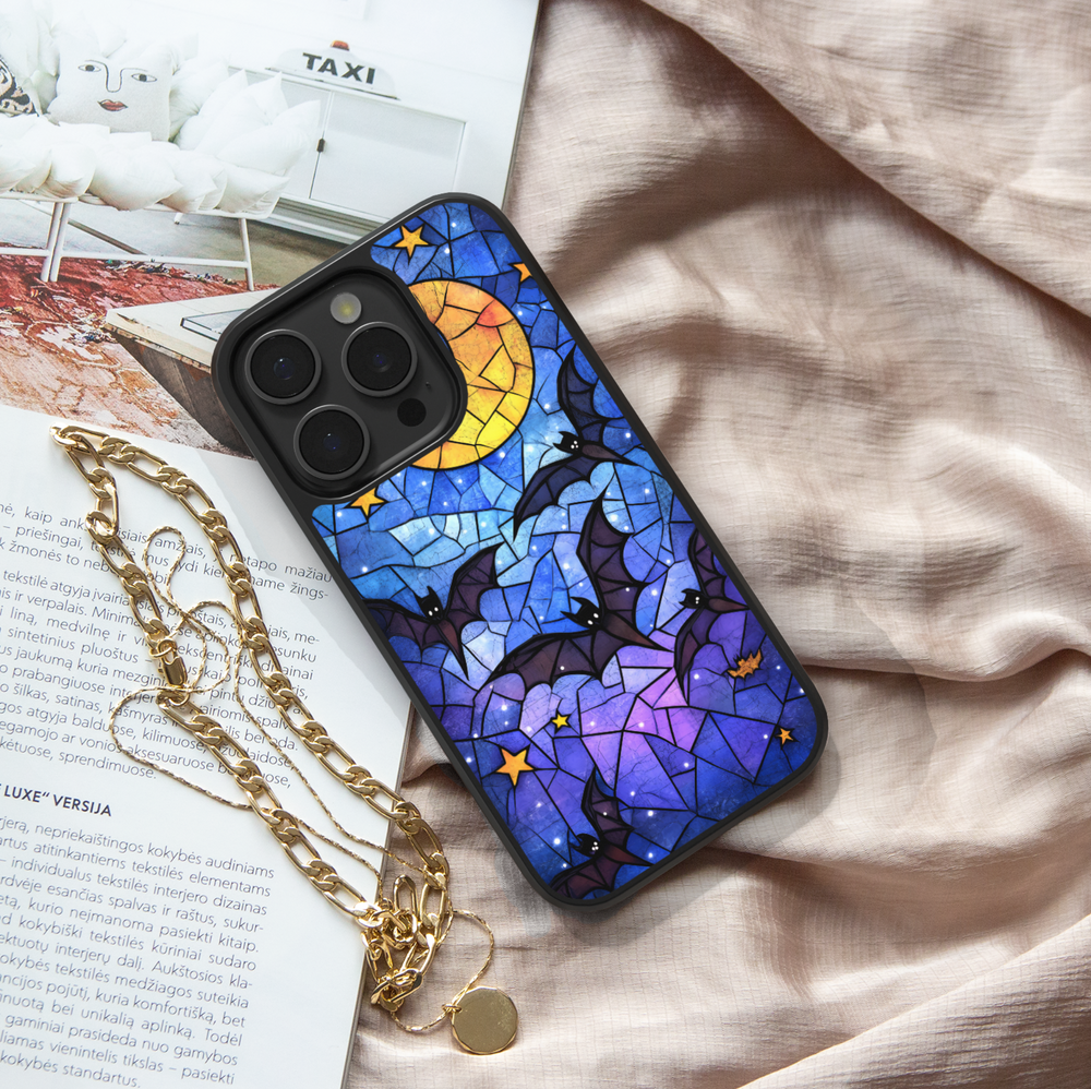 Stained glass Halloween iPhone case with moon, flying bats, stars, gothic aesthetic, spooky night phone cover, protective case for iPhone.