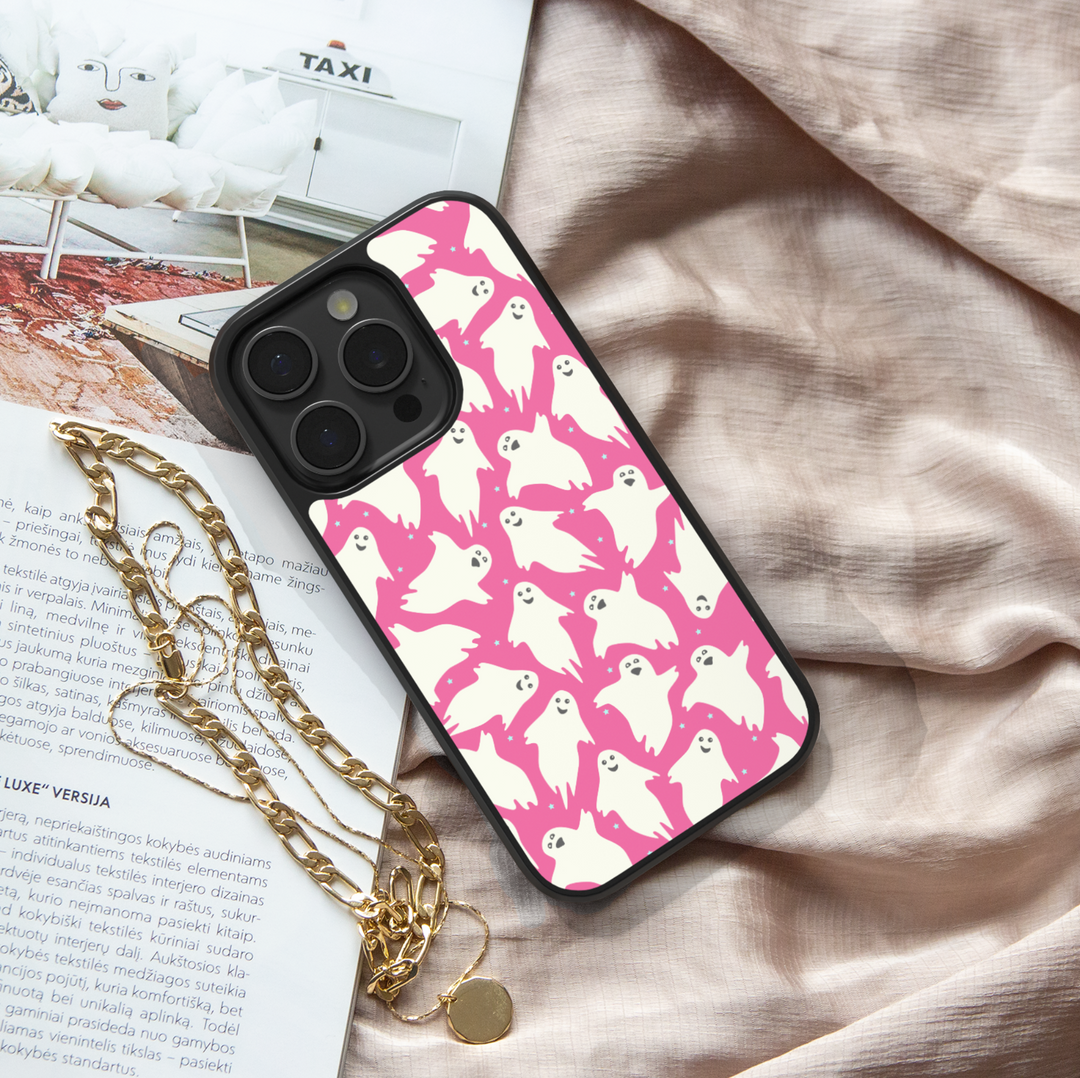 Girly pink Halloween iPhone case with spider webs, pumpkins, and cute spooky design.