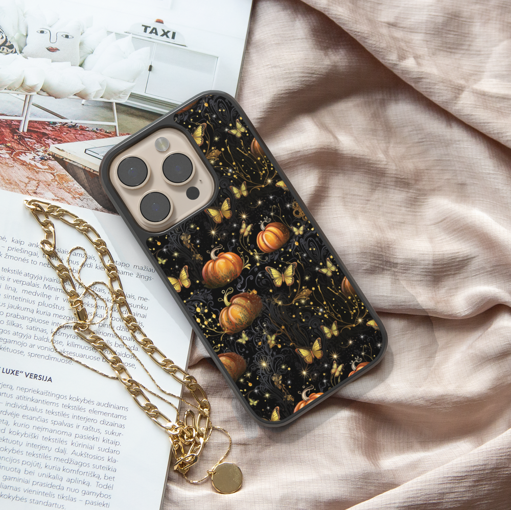 Halloween phone case with glowing golden butterflies, orange pumpkins, and sparkling details on a black background, aesthetic fall iPhone cover
