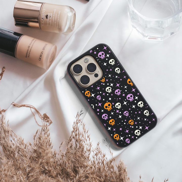 Halloween phone case with cute black cats, spooky ghosts, bats, bones, and spider webs – Halloween aesthetic design for iPhone and Samsung.
