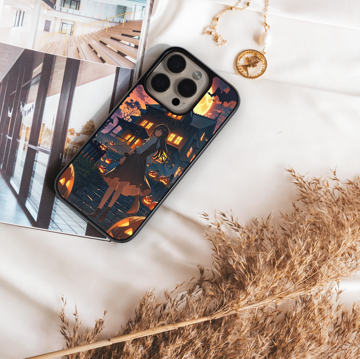 Halloween anime phone case with witch girl, haunted house, glowing pumpkins, bats, and full moon night sky.