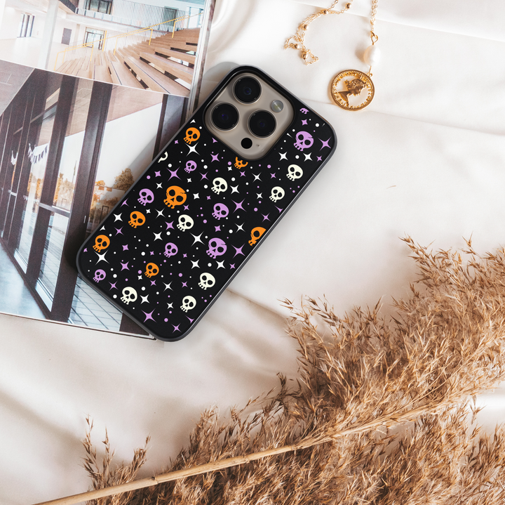 Halloween phone case with cute black cats, spooky ghosts, bats, bones, and spider webs – Halloween aesthetic design for iPhone and Samsung.