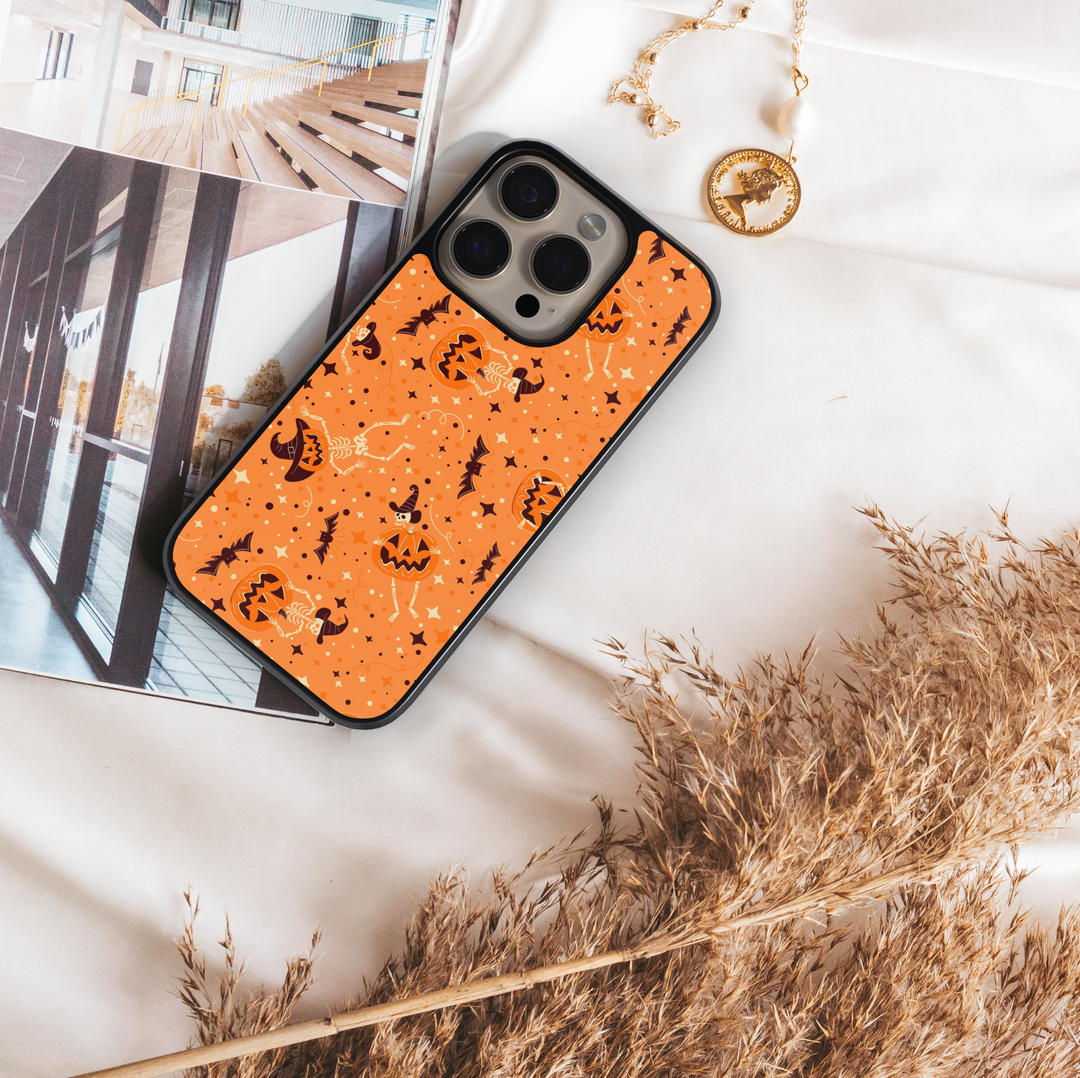 Orange pumpkin skeleton iPhone case with bats, witch hats, and Halloween stars – spooky cute protective phone cover for iPhone.