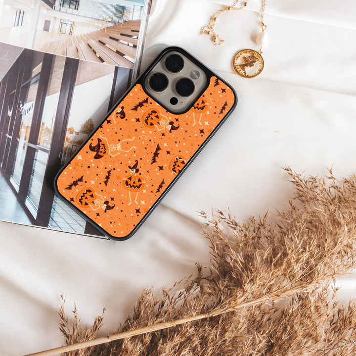 Orange pumpkin skeleton iPhone case with bats, witch hats, and Halloween stars – spooky cute protective phone cover for iPhone.