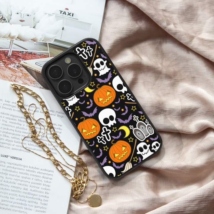Halloween iPhone tough case with pumpkins, skulls, bats, and spooky cute illustrations on black background.