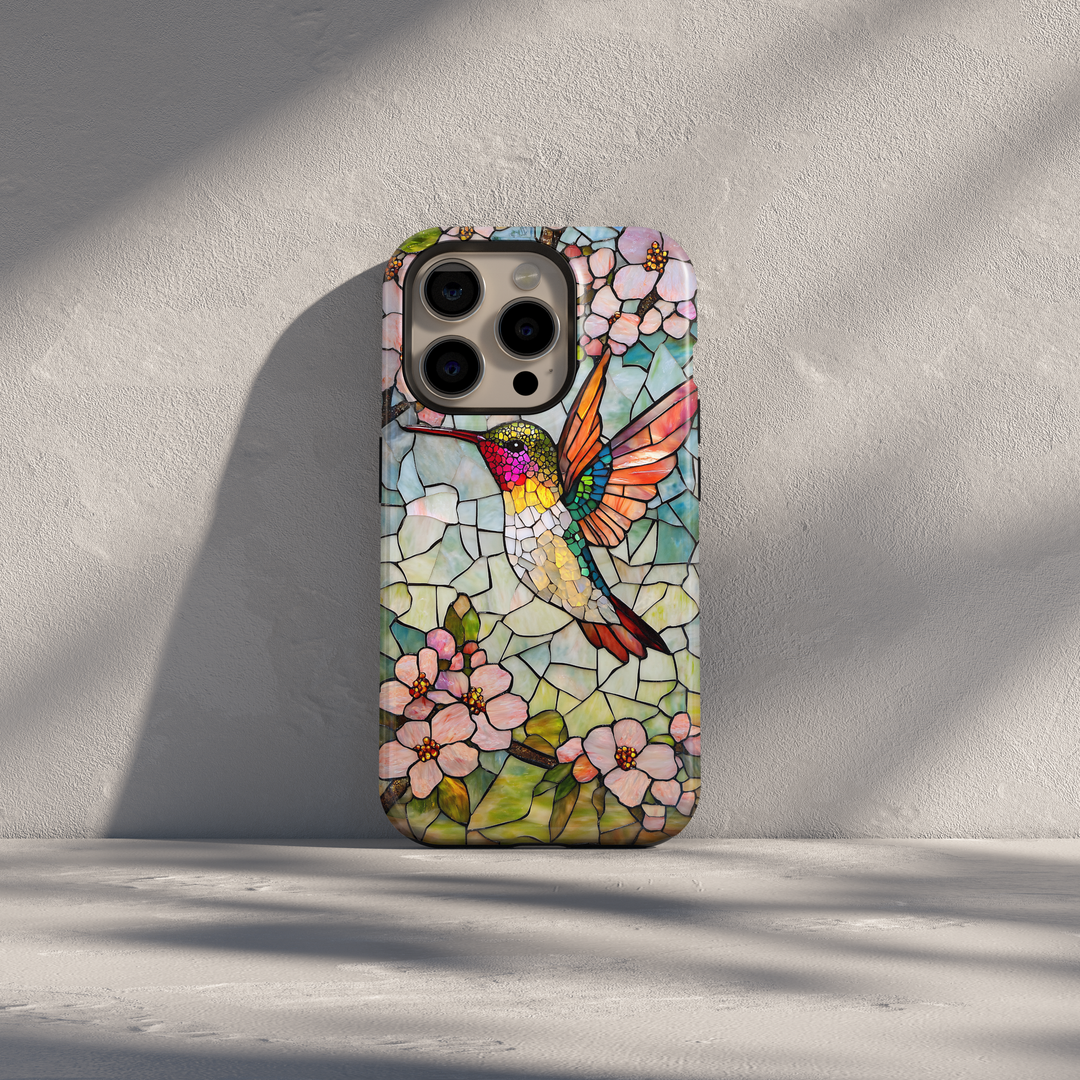 Stained glass hummingbird iPhone case with pastel flowers and mosaic background