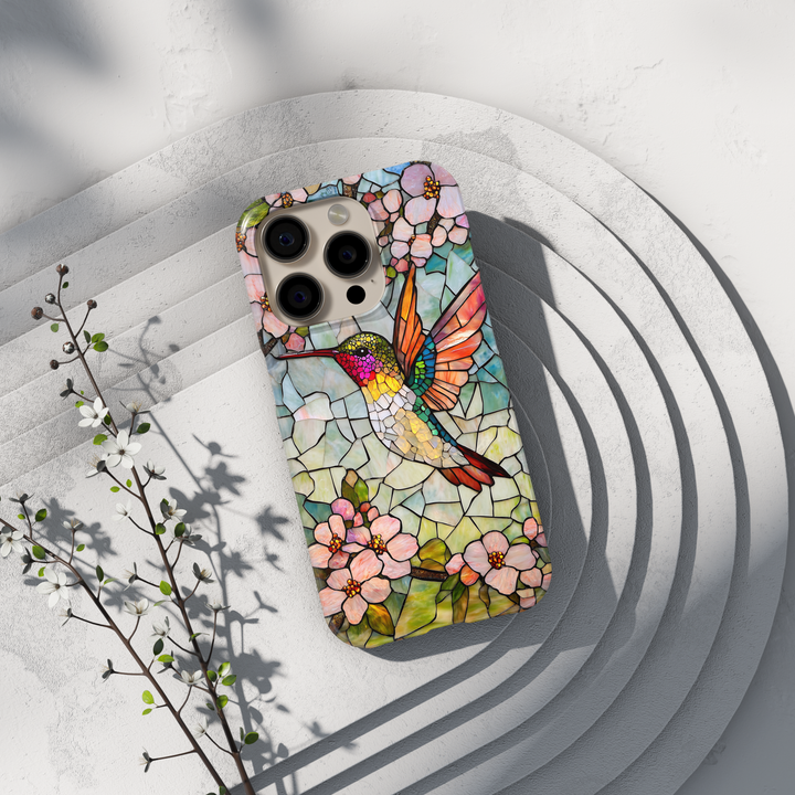 Stained glass hummingbird iPhone case with pastel flowers and mosaic background