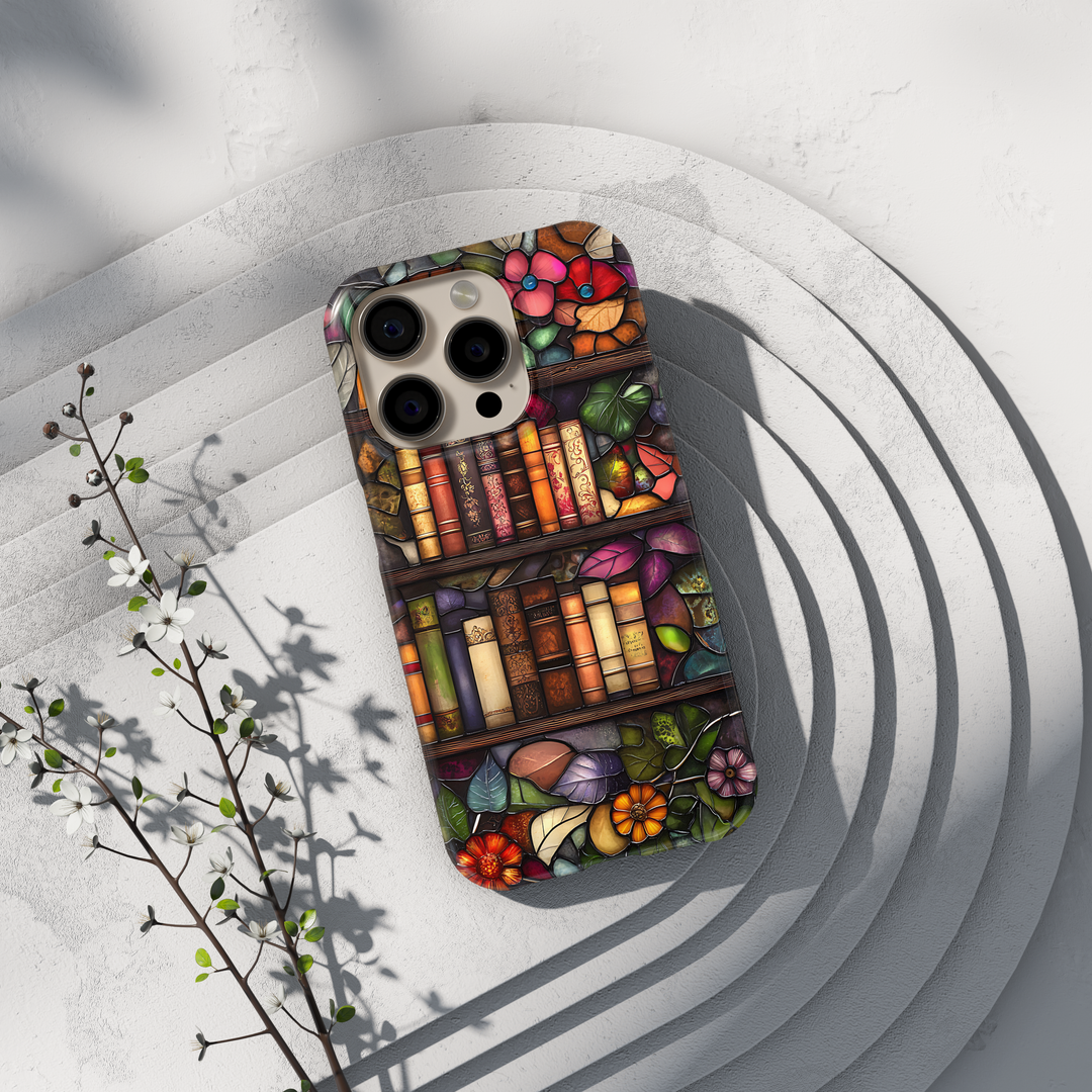 Stained glass style iPhone case with vintage bookshelves, floral leaves, and warm artistic tones in an elegant library-inspired design