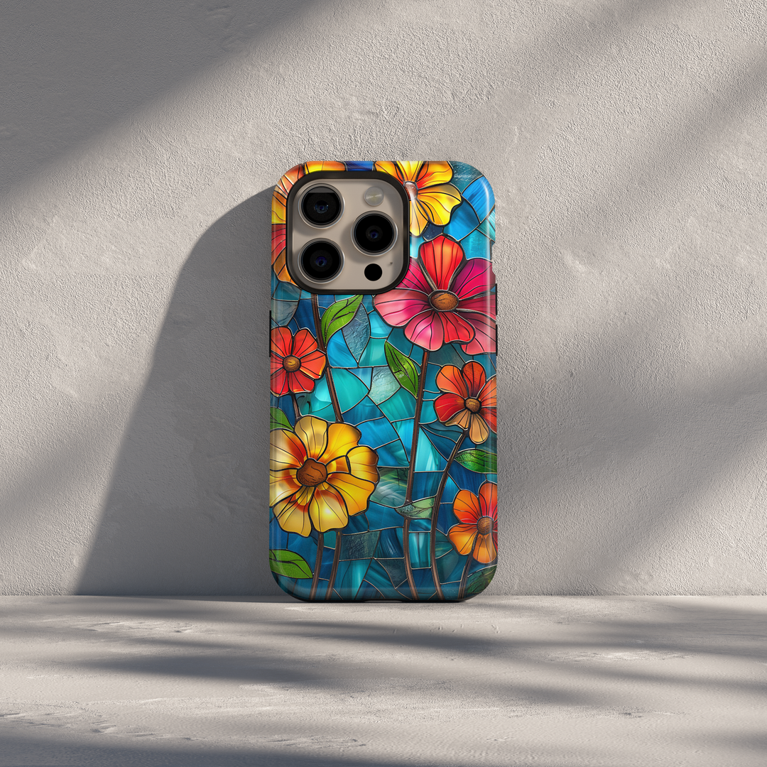 Colorful stained glass floral iPhone case with vibrant flowers and blue glass background