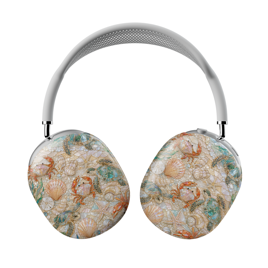 Sea turtle AirPods Max case featuring sea turtles, starfish, seashells, pearls, coral accents, and coastal ocean treasures on a pearlescent beach-inspired background.