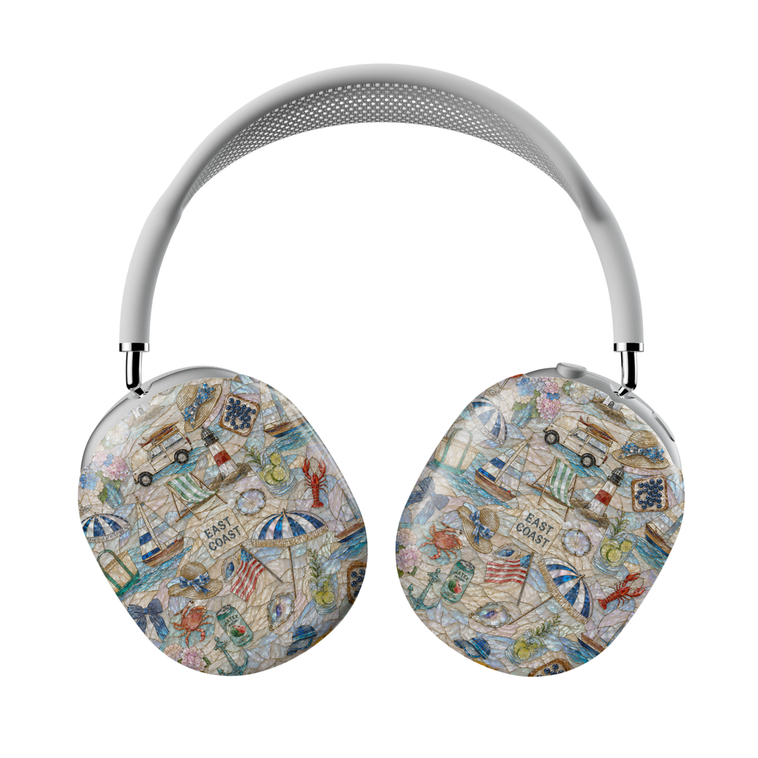 Coastal-themed AirPods Max case featuring anchors, hydrangeas, sailboats, seashells, beach drinks, a vintage surf wagon, and nautical summer details on a pearlescent background.