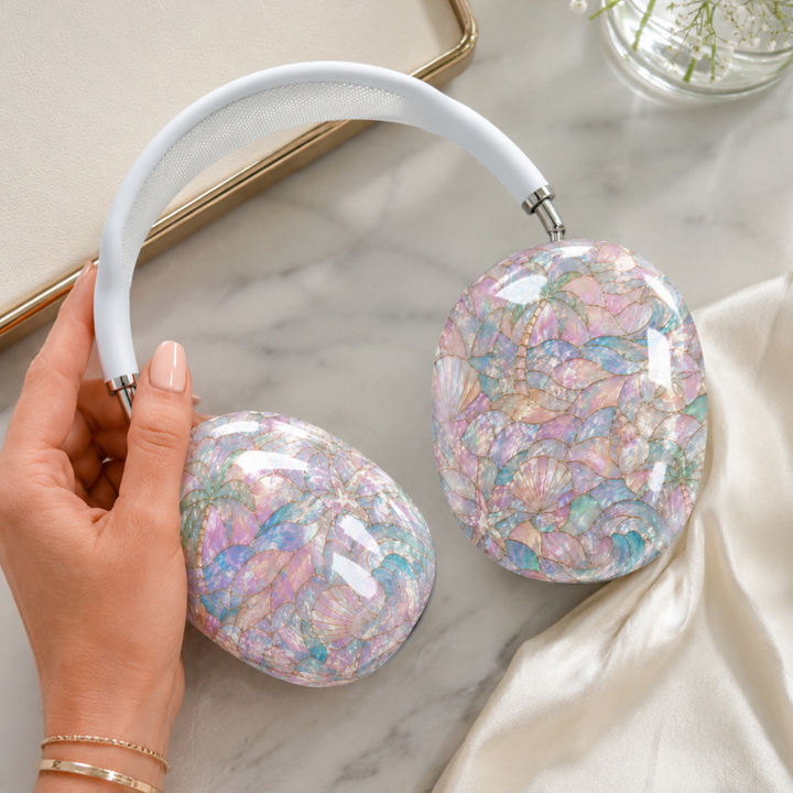 Pastel coastal AirPods Max cover featuring seashells, tropical waves, palm trees, starfish, and pearlescent beach-inspired artwork.
