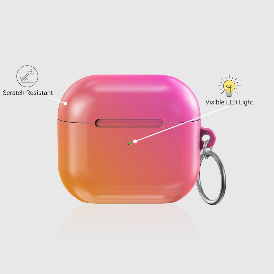 Glossy ombre AirPods case in pink and orange gradient with silver keychain ring

