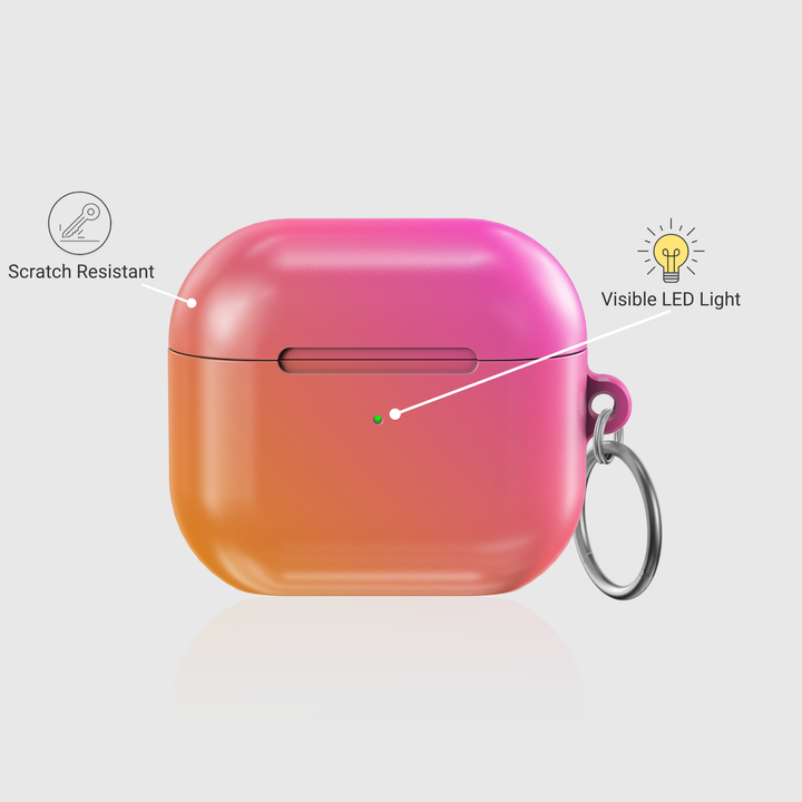 Glossy ombre AirPods case in pink and orange gradient with silver keychain ring

