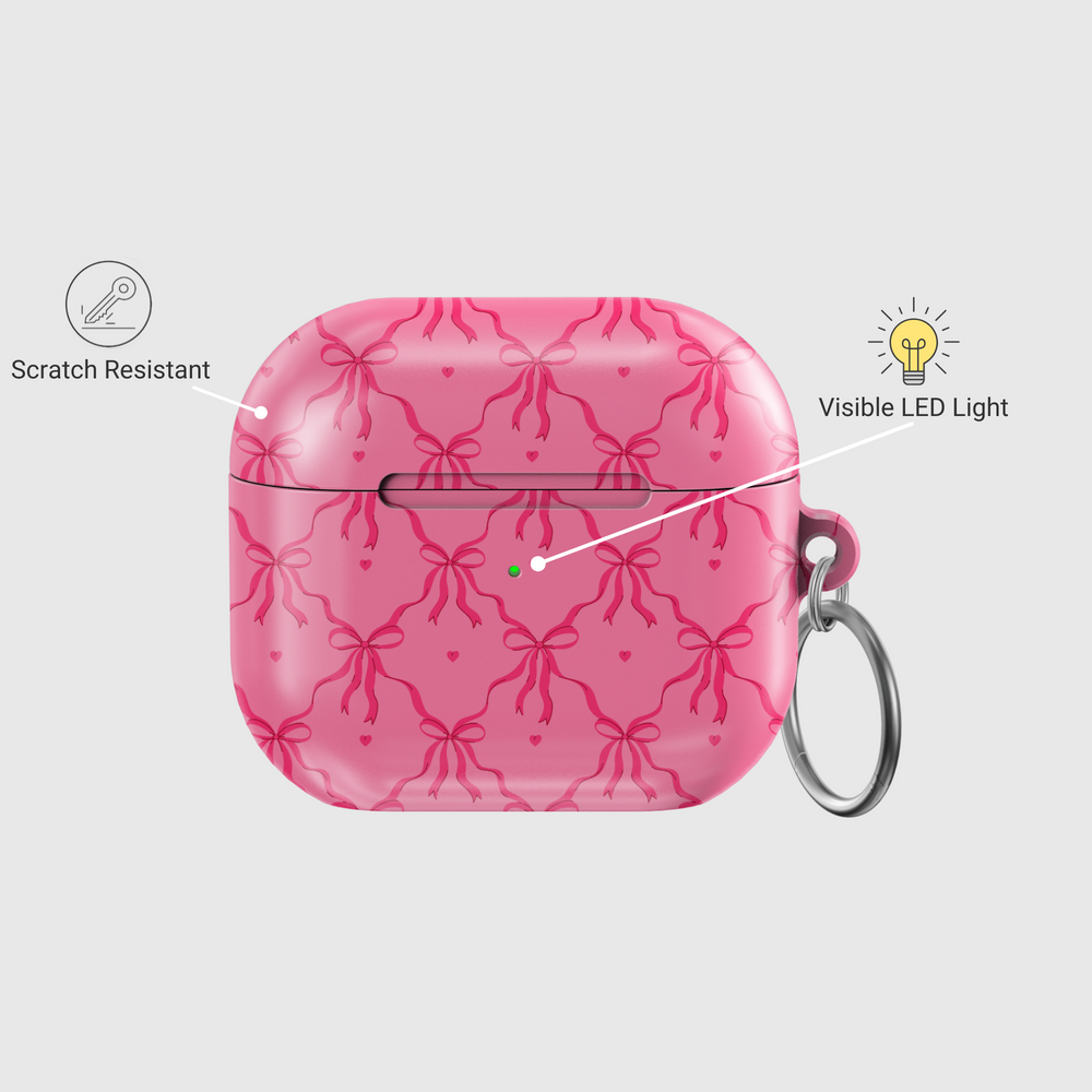 Pink AirPods case cover with bows and hearts design. Compatible with AirPods 3rd Gen. Includes metal keyring for easy carrying. Cute and feminine aesthetic.