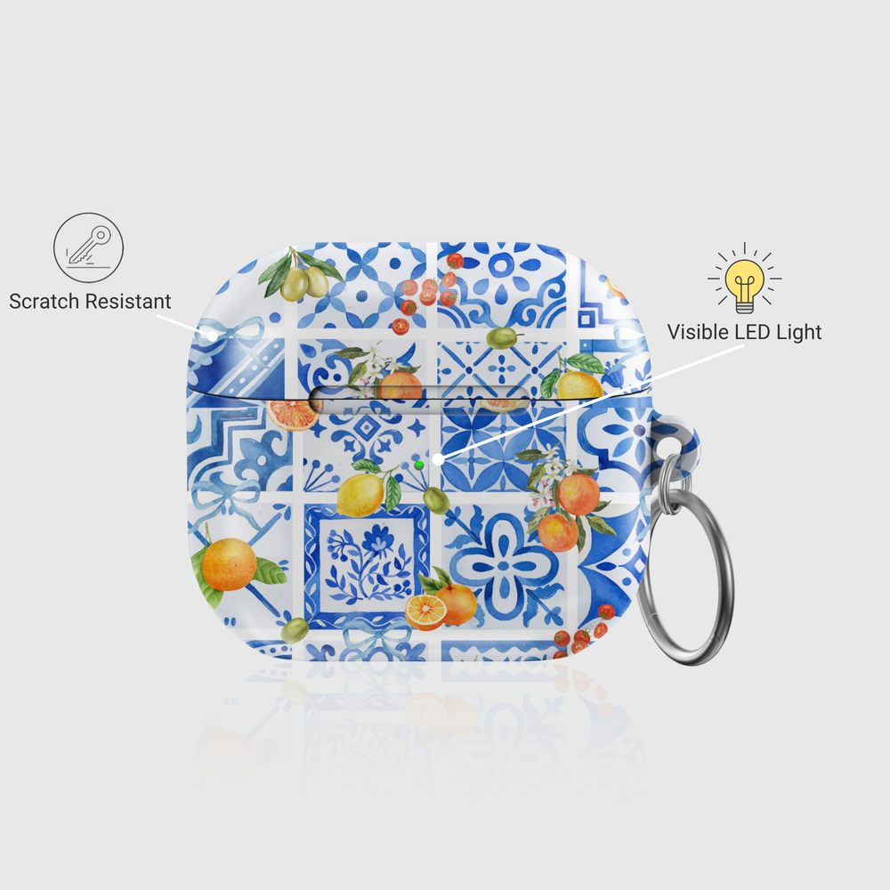 AirPods case with blue tile Mediterranean print and citrus fruit design, silver keychain ring attached

