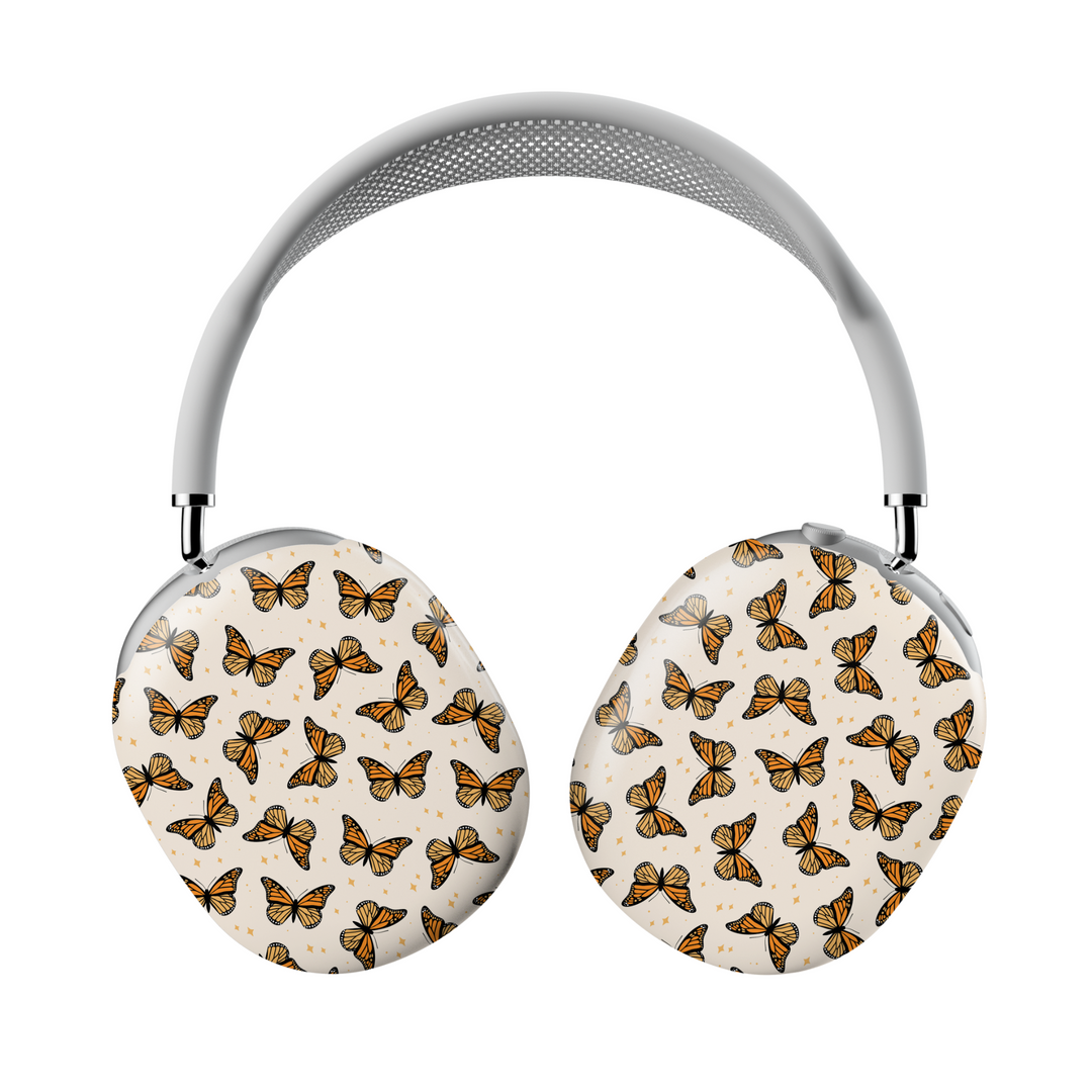 AirPods Max case with orange monarch butterfly pattern on cream background – aesthetic headphone skin for women