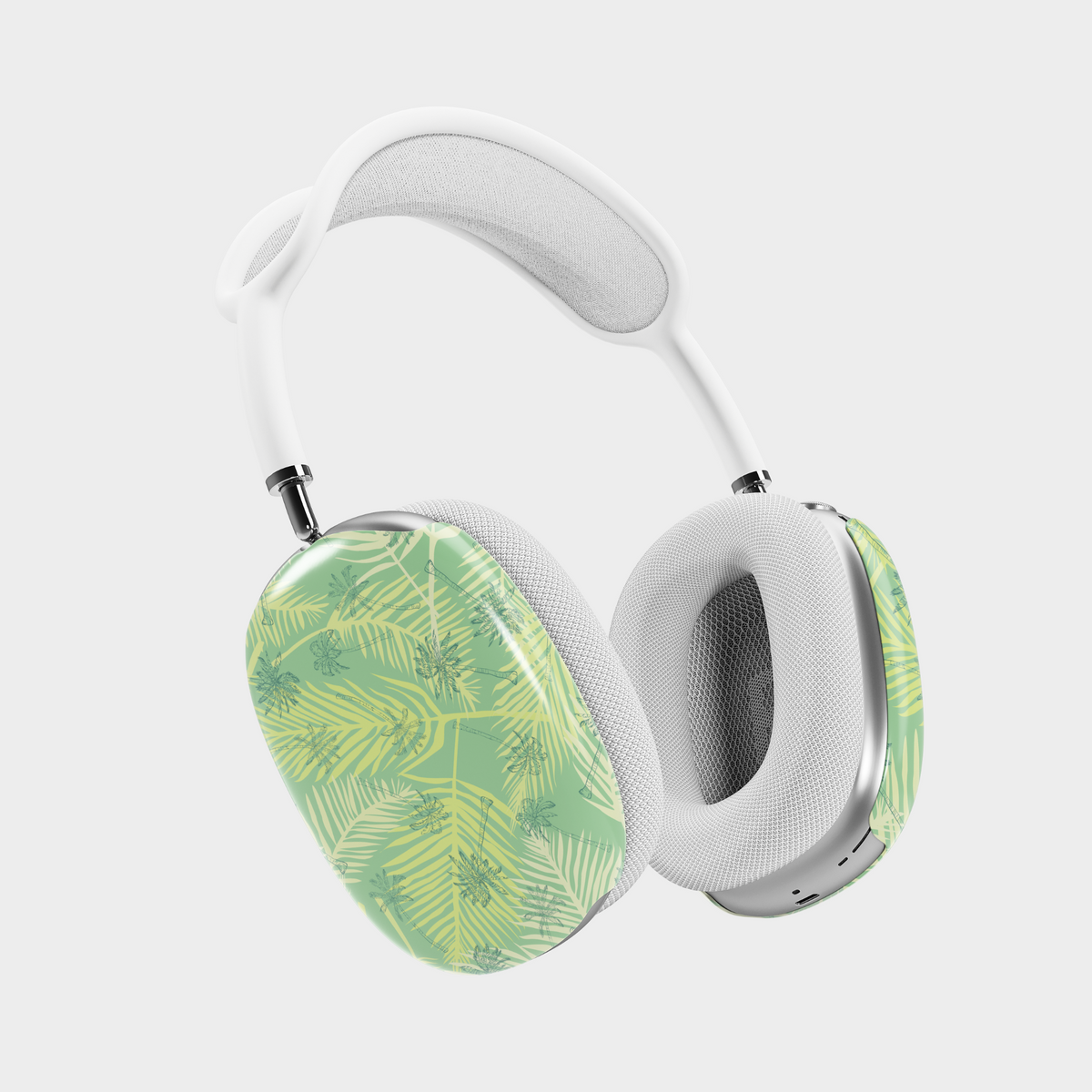 AirPods Max cover with green tropical leaves and palm frond pattern – botanical summer design protective skin.