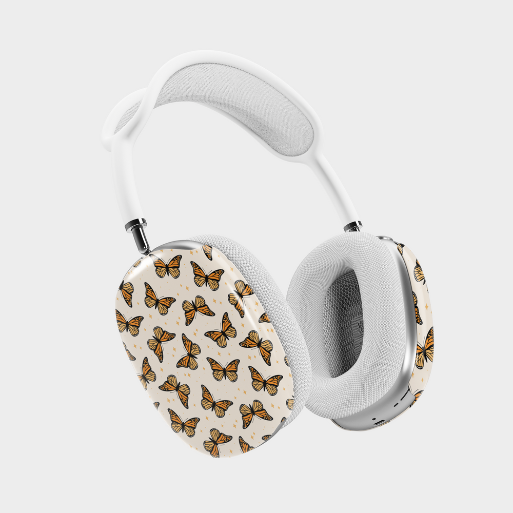 AirPods Max case with orange monarch butterfly pattern on cream background – aesthetic headphone skin for women