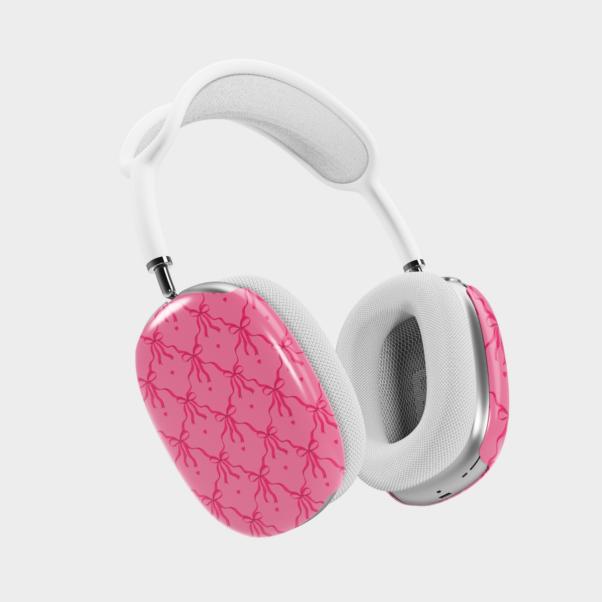 Pink AirPods Max case cover with bows and hearts design. Compatible with AirPods Max. Cute and feminine aesthetic.