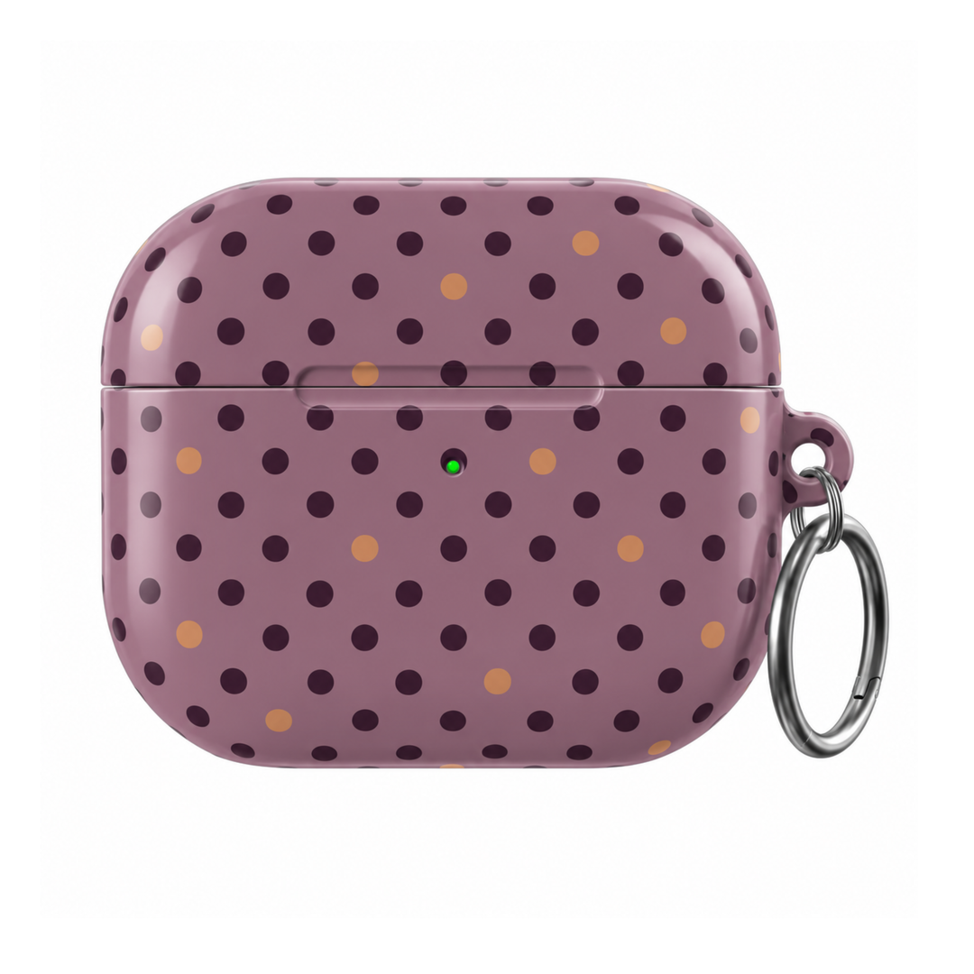 Autumn Confetti AirPods Case featuring a muted mauve background with deep burgundy and warm caramel polka dots and a silver carabiner.
