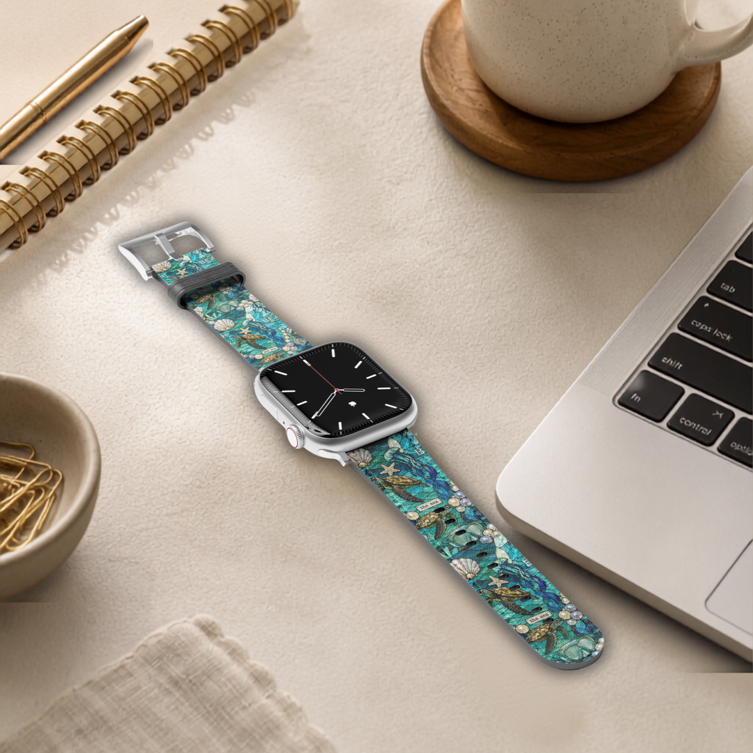 Coastal Mosaic Apple Watch band featuring stained-glass inspired sea turtles, seashells, pearls, and ocean artwork printed on premium vegan leather with stainless steel hardware. Compatible with Apple Watch Series 1–10, SE, Ultra, and Ultra 2.