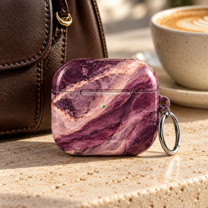 Plum Veil AirPods Case featuring layered deep plum, blackberry purple, dusty mauve, blush pink and ivory marble with a silver carabiner.
