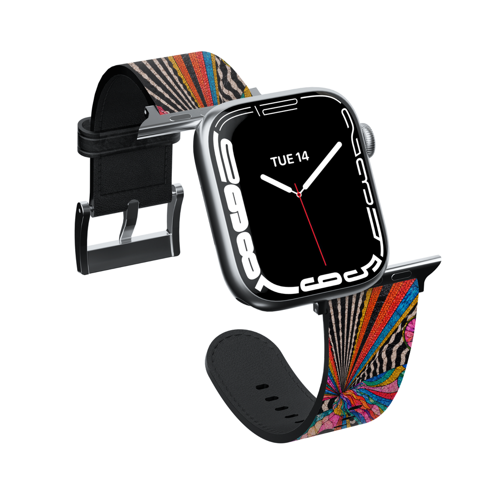Lifestyle image of a colorful stained glass Apple Watch band featuring vibrant abstract mosaic artwork with rainbow colors, zebra accents, and premium vegan leather, shown in feminine desk setting. Compatible with Apple Watch Series 1–10, SE, Ultra, and Ultra 2.