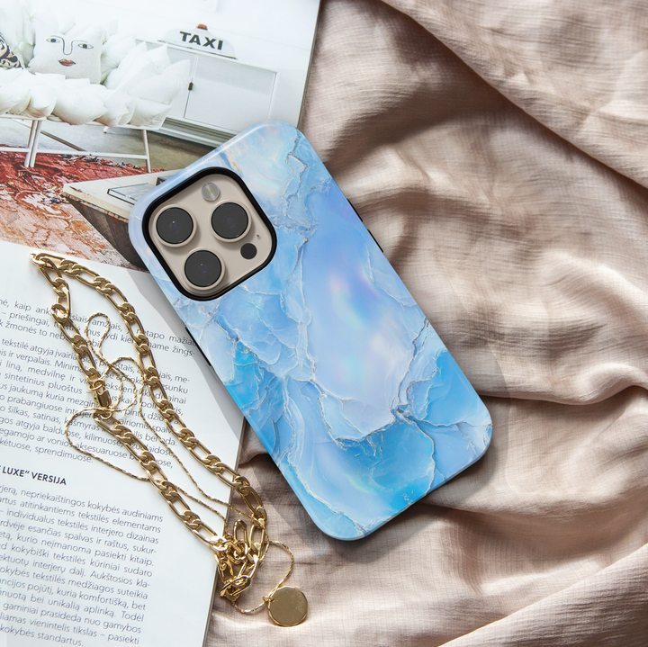 Light blue opal marble iPhone case with shimmer finish – compatible with iPhone 16 Pro, 15, 14 Plus, Galaxy S24 Ultra, and MagSafe.