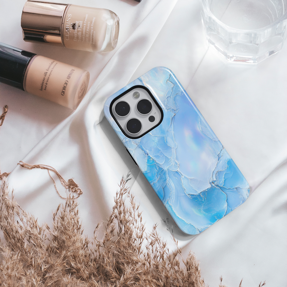 Light blue opal marble iPhone case with shimmer finish – compatible with iPhone 16 Pro, 15, 14 Plus, Galaxy S24 Ultra, and MagSafe.